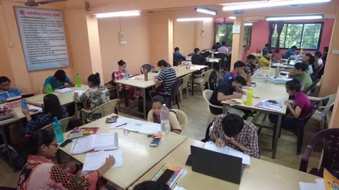 Group of students study together in College Library. Stock Footage 220499295