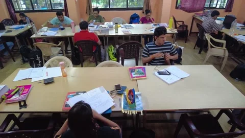 Group of students study together in College Library. Stock Footage 220499304