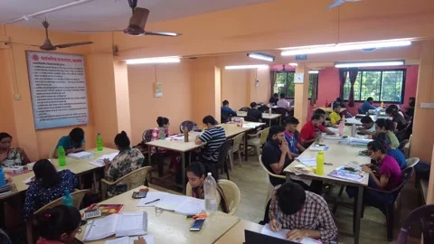 Group of students study together in College Library. Stock Footage 220499340