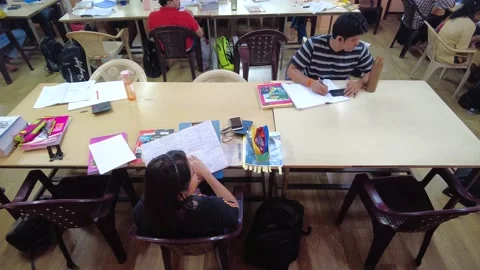 Group of students study together in College Library. Stock Footage 220499343