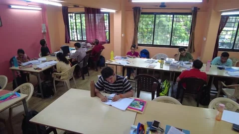 Group of students study together in College Library. Stock Footage 220499352