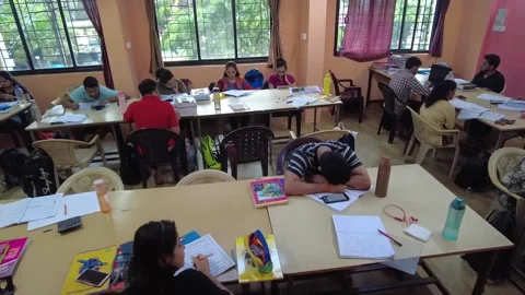 Group of students study together in Library (Time lapse). Stock Footage 220499420
