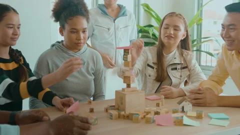 Group of students studying and playing with teacher, education and learning c Видео 171174082