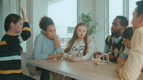 Group of students studying and playing with teacher, education and learning c Vídeos de archivo 171174657