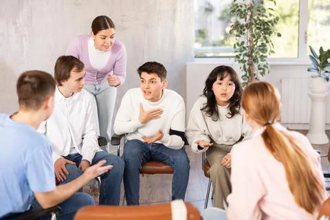 Group of students studying for difficult test in studygroup together Stock Photos