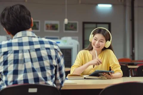 Group of students studying together in library. Two Asian students learning.. Stock-Fotos