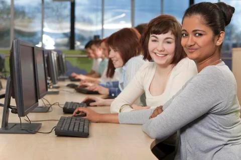 Group of students using computers at college Stock Photos