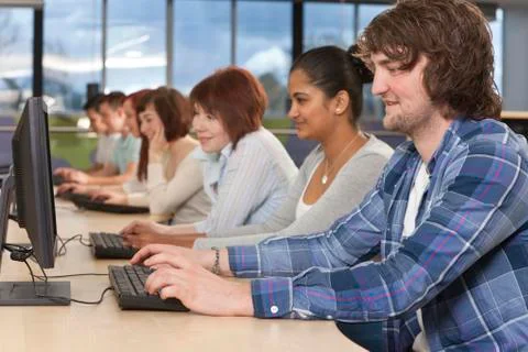 Group of students using computers at college Stock Photos