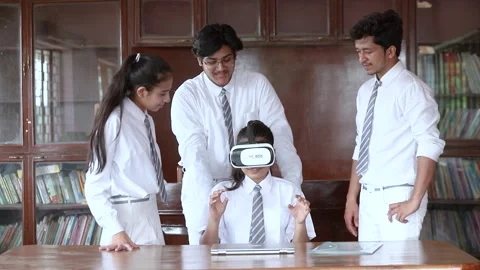 Group of students using virtual glass experiencing  Metaverse technology Stock Footage 165431095