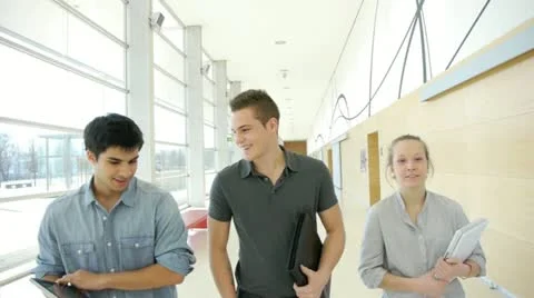 Group of students walking in school hallway Stock Footage 14826895
