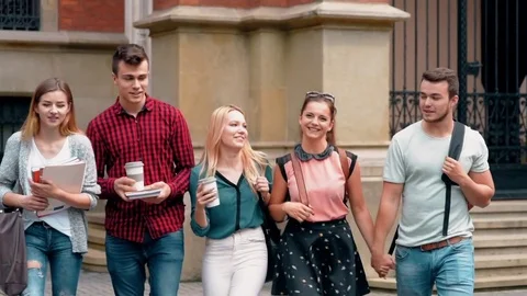 Group of students walking united Stock Footage