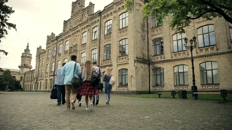 Group of students walking to the university Stock Footage 65337330