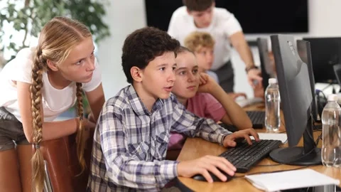 Group of students working at computer in classroom Stock Footage 344774050