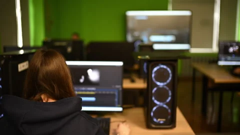 Group of students working on computers in a digital classroom environment Stock Footage 332736438