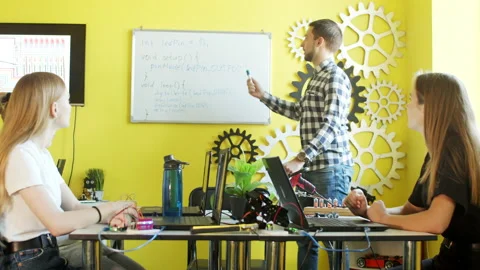 Group of students working together in classroom with laptops Stock Footage 140765309