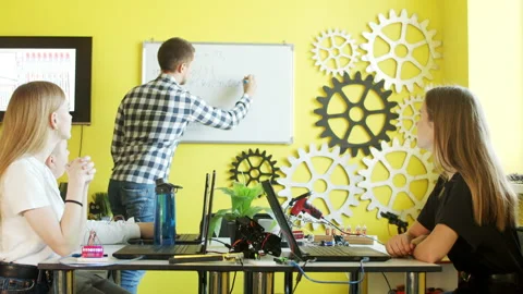 Group of students working together in classroom with laptops Stock-Footage 140765793