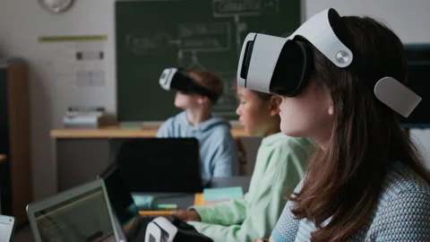 Group of Students Working with VR Glasses and Laptops During Programming Lesson Stock Footage 317643680
