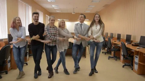 Group of successful people dancing in a computer room Stock Footage 80849491