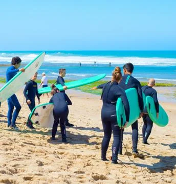 Group of surfer going surfing Stock Photos