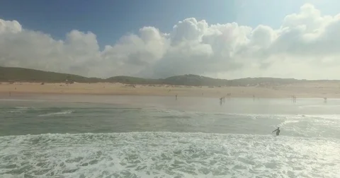 Group of Surfers Catching Waves Stock Footage 69890146