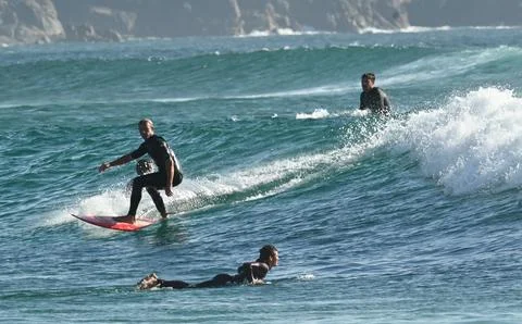 A group of surfers conquer the waves off Ferrol, (10) , 21/082025 Stock Photos