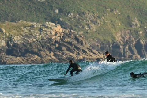 A group of surfers conquer the waves off Ferrol, (13) , 21/08/2025 Stock Photos