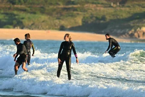 A group of surfers conquer the waves off Ferrol, (19) , 21/08/2025 Stock Photos
