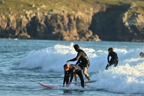 A group of surfers conquer the waves off Ferrol, (17) ,21/08/2025 Stock Photos