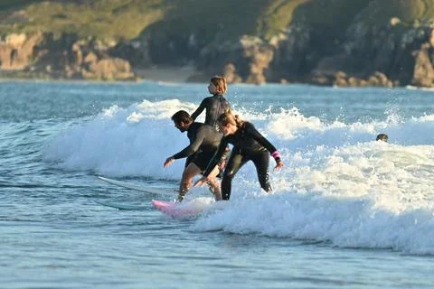 A group of surfers conquer the waves off Ferrol, (18) , 21/08/2025 Fotos Stock