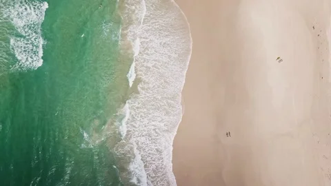 A group of surfers paddling over a large wave at Gold Coast. Concept beauty and Video stock 294636309
