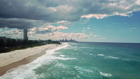 A group of surfers paddling over a large wave at Gold Coast. Concept beauty and Stock Footage 294636368