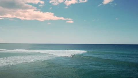 A group of surfers paddling over a large wave at Gold Coast. Concept beauty and Stock Footage 294636705