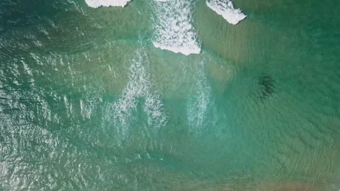 A group of surfers paddling over a large wave at Gold Coast. Concept beauty and Video stock 294636984