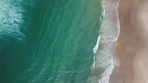 A group of surfers paddling over a large wave at Gold Coast. Concept beauty and Video stock 294637038