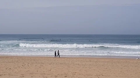 A group of surfers waiting for a suitable wave. 動画素材 103145277