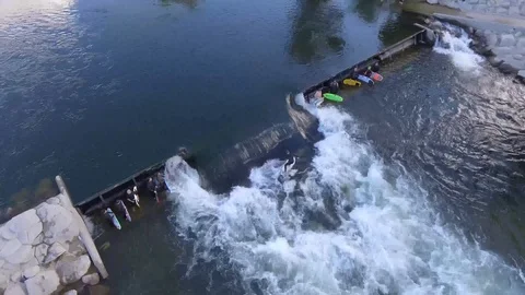 Group Surfing on River Drone Circles Stock Footage 100090259