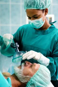 Group of surgeon team at work in operating room in hospital Stock Photos