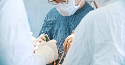 A group of surgeons holding tools in hands. Medicine, surgery, health care Stock Footage 121103678
