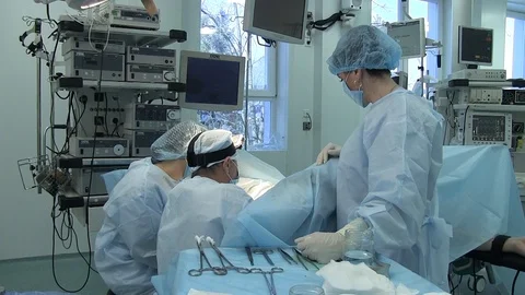 A group of surgeons performs an operation. patient during gynecological surgery. Vídeo Stock 125584318