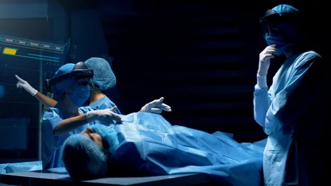 Group of surgeons using augmented reality holographic holo lens headsets interac Video stock 119613527