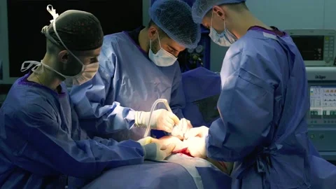 A group of surgeons works in the operating room. Stock Footage 270466211