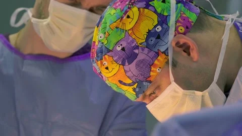 A group of surgeons works in the operating room. Stock Footage 270473217