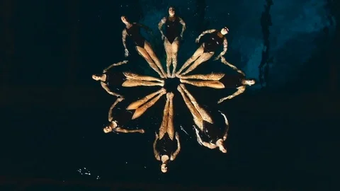 Group of synchronized swimmers performing underwater Stock Footage 89424595