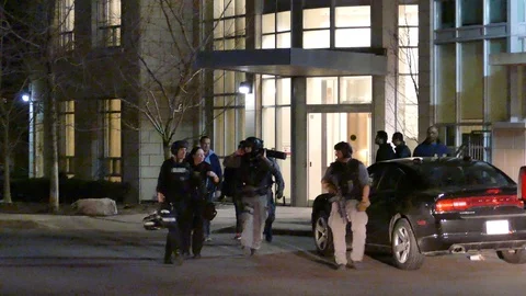 Group of tactical cops and paramedics walking with female - 24fps 1080p Stock Footage 91567375