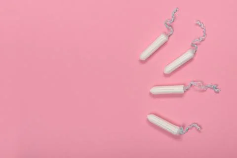 Group of tampons seen from a high angle view on a pink background with space  Stock Photos