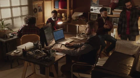 Group of Tech Lovers Interacting in Garage Office Stock Footage 263302374