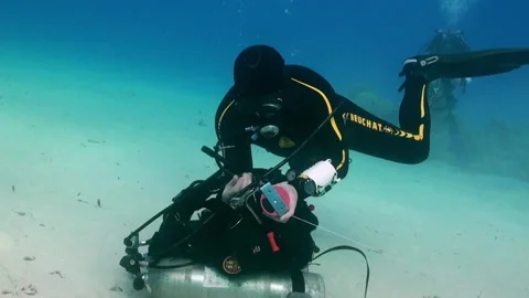 Group of technical divers improve their skills undersea Stock Footage 231644783