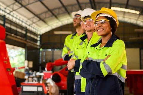 Group of technicians engineers workers posing to camera with smile 写真素材