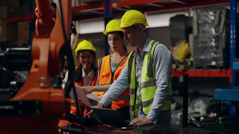Group of technicians team checking and repairing robotic machinery Stock Footage 237928450
