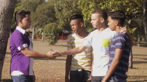Group Of Teenagers Boy Refusing To Smoke E-cig Stock Footage 64277968